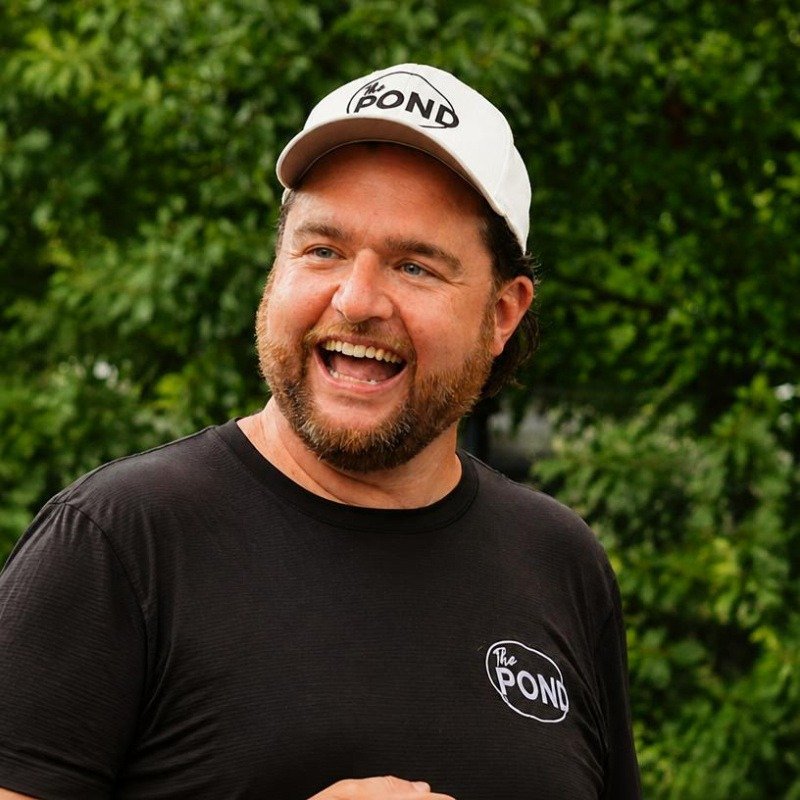 Benny Fisher, founder of The Pond, wearing The Pond hat and shirt