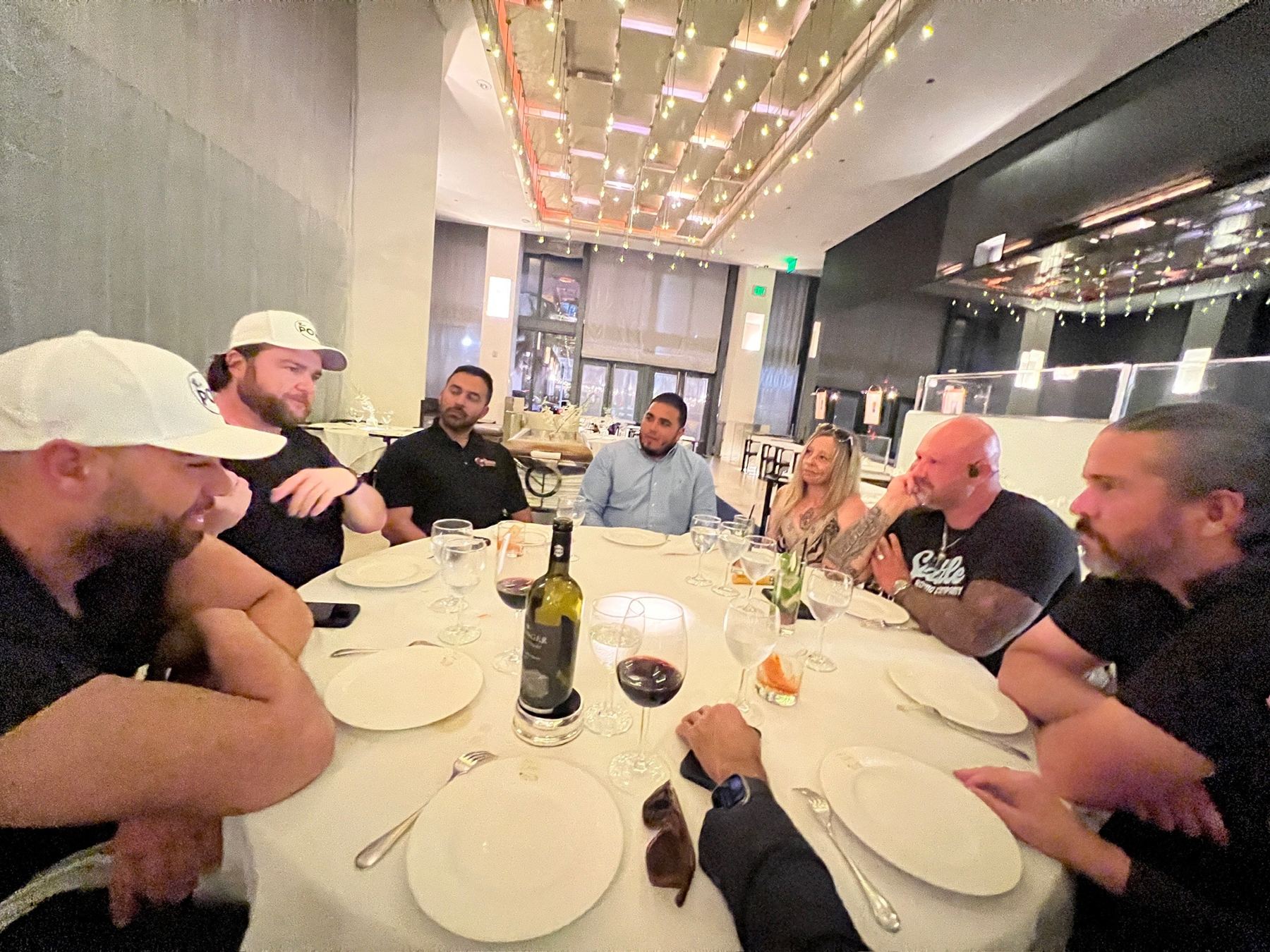 Members around the table at a pop-up dinner